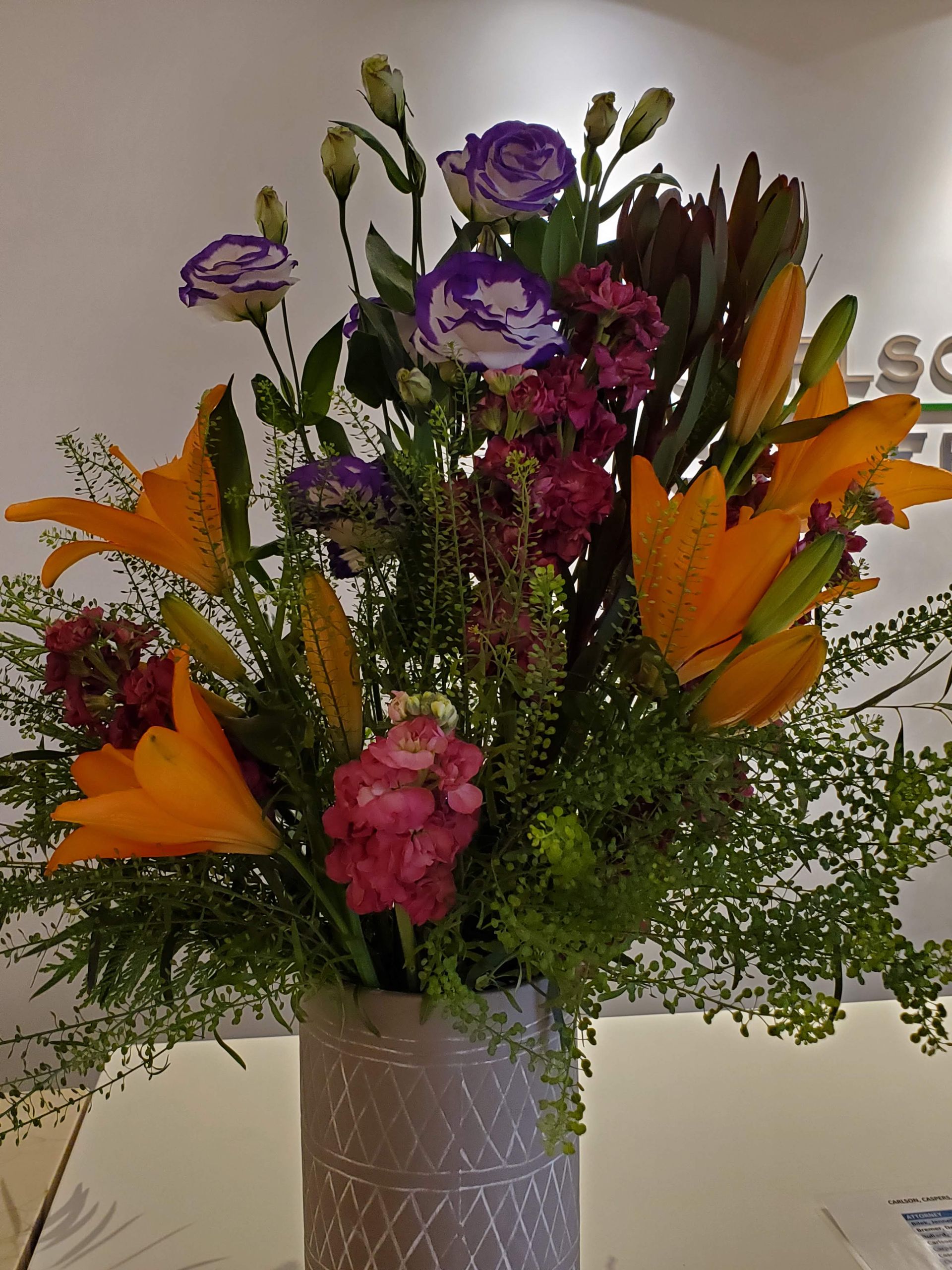 A vase filled with flowers is sitting on a table.