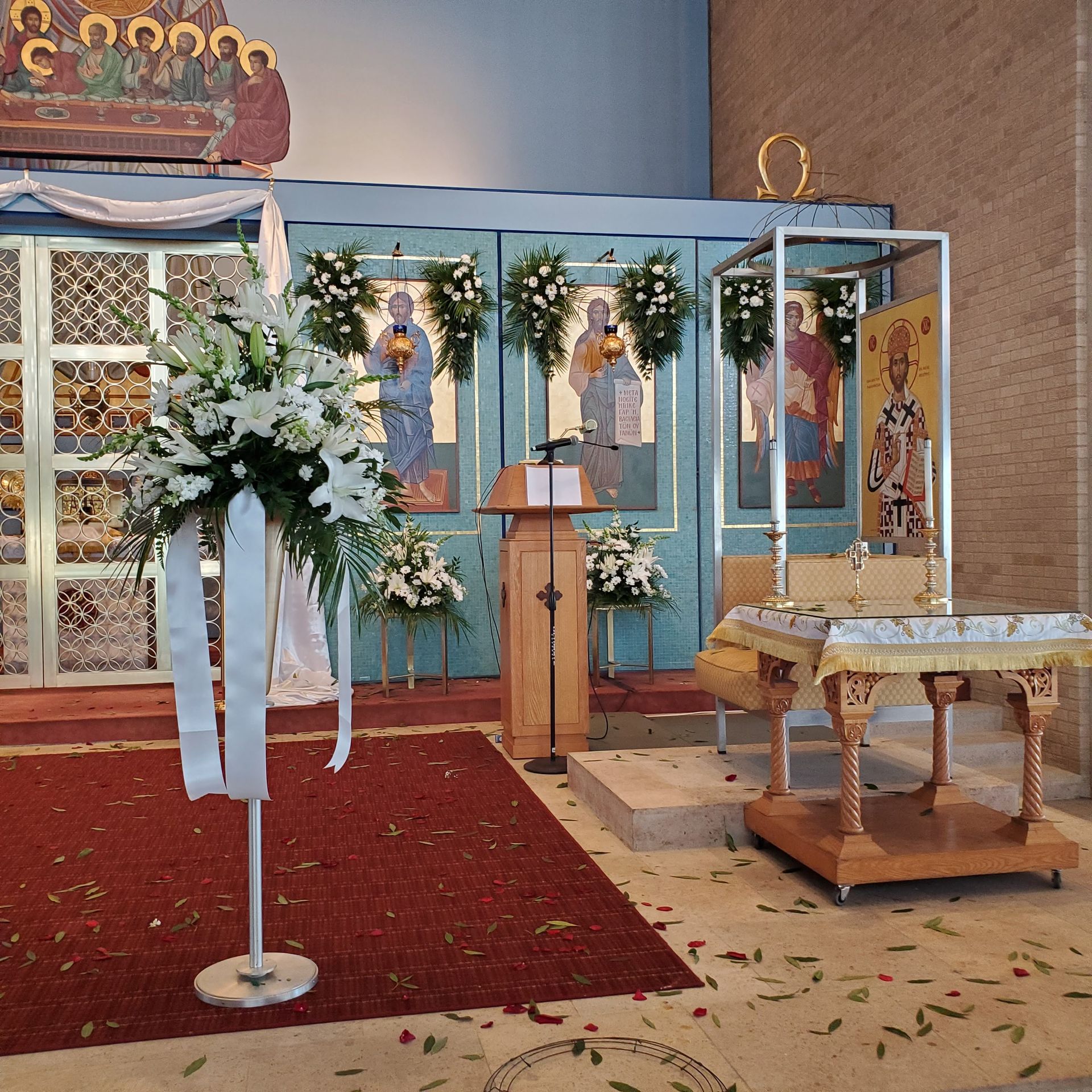 Decorated with flowers and a cross.