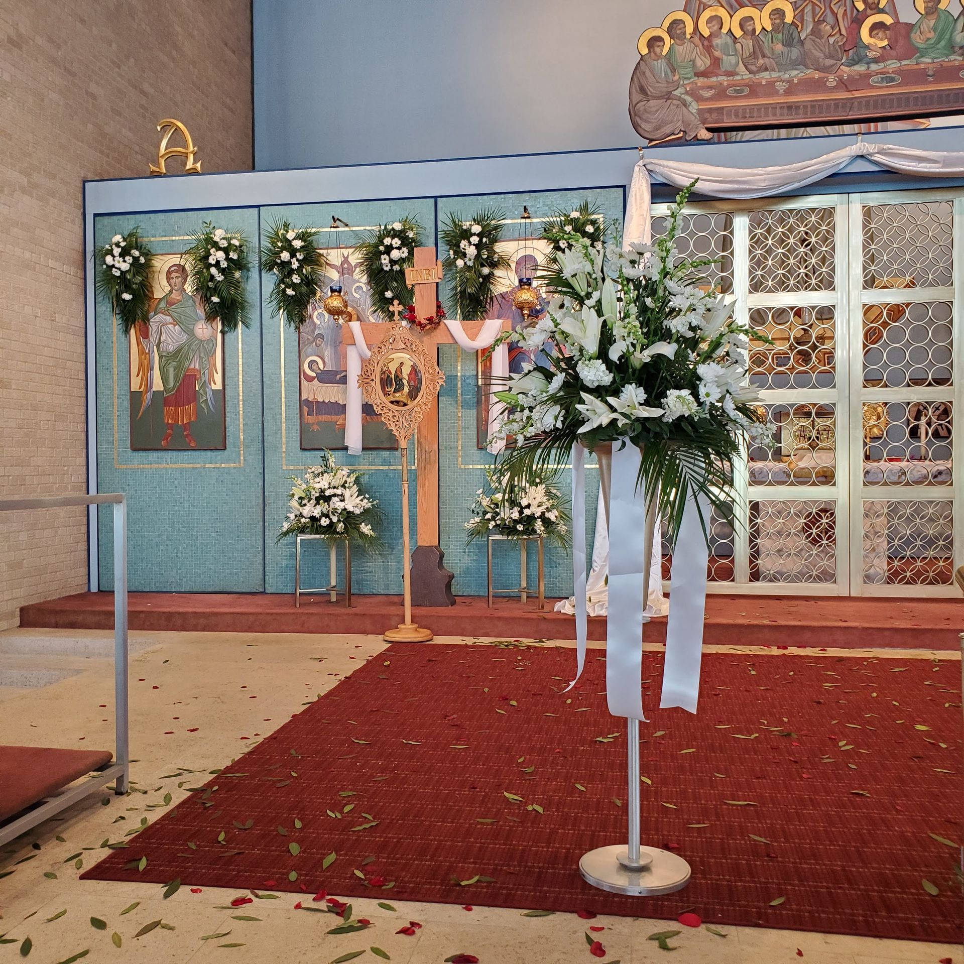 Decorated with flowers and a cross.