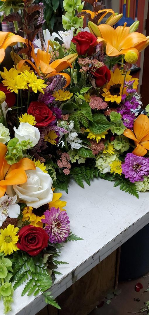 A bunch of flowers are sitting on a table.