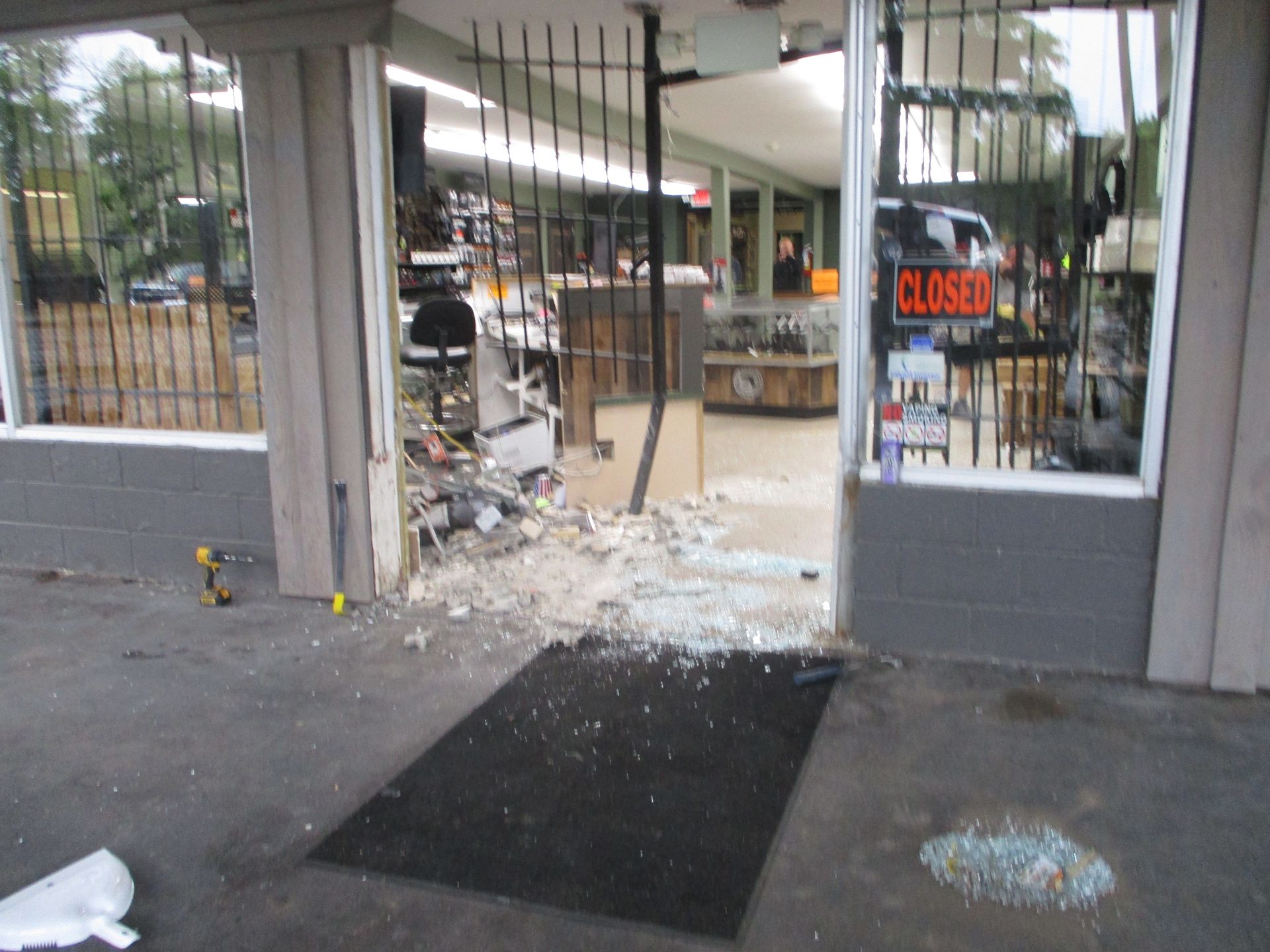 A store with a closed sign on the window