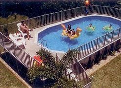 A group of people is swimming in a swimming pool.