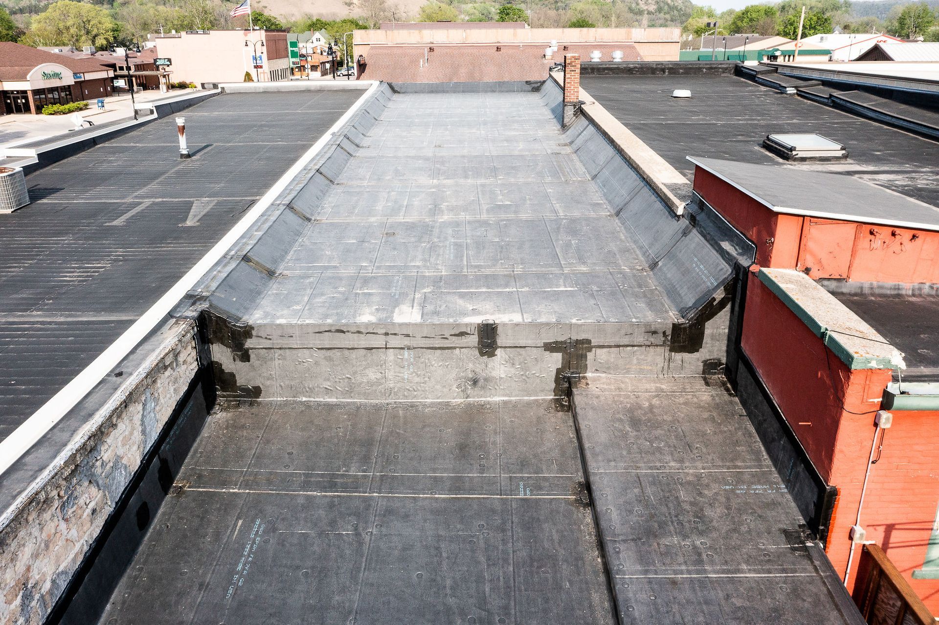 The roof of a building with a black roof