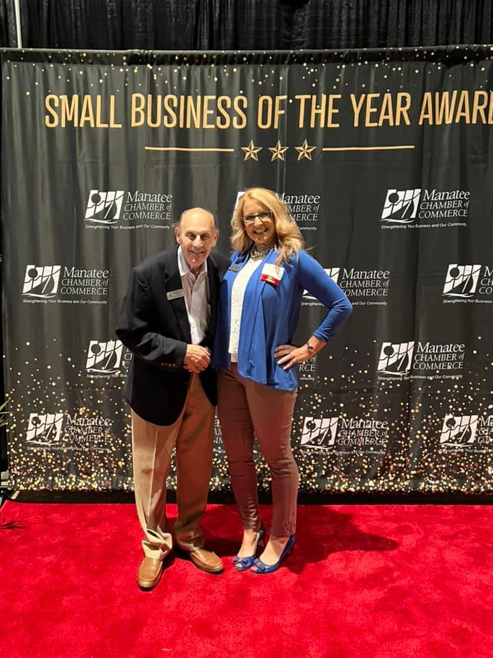 Joanie and her father at the awarding ceremony