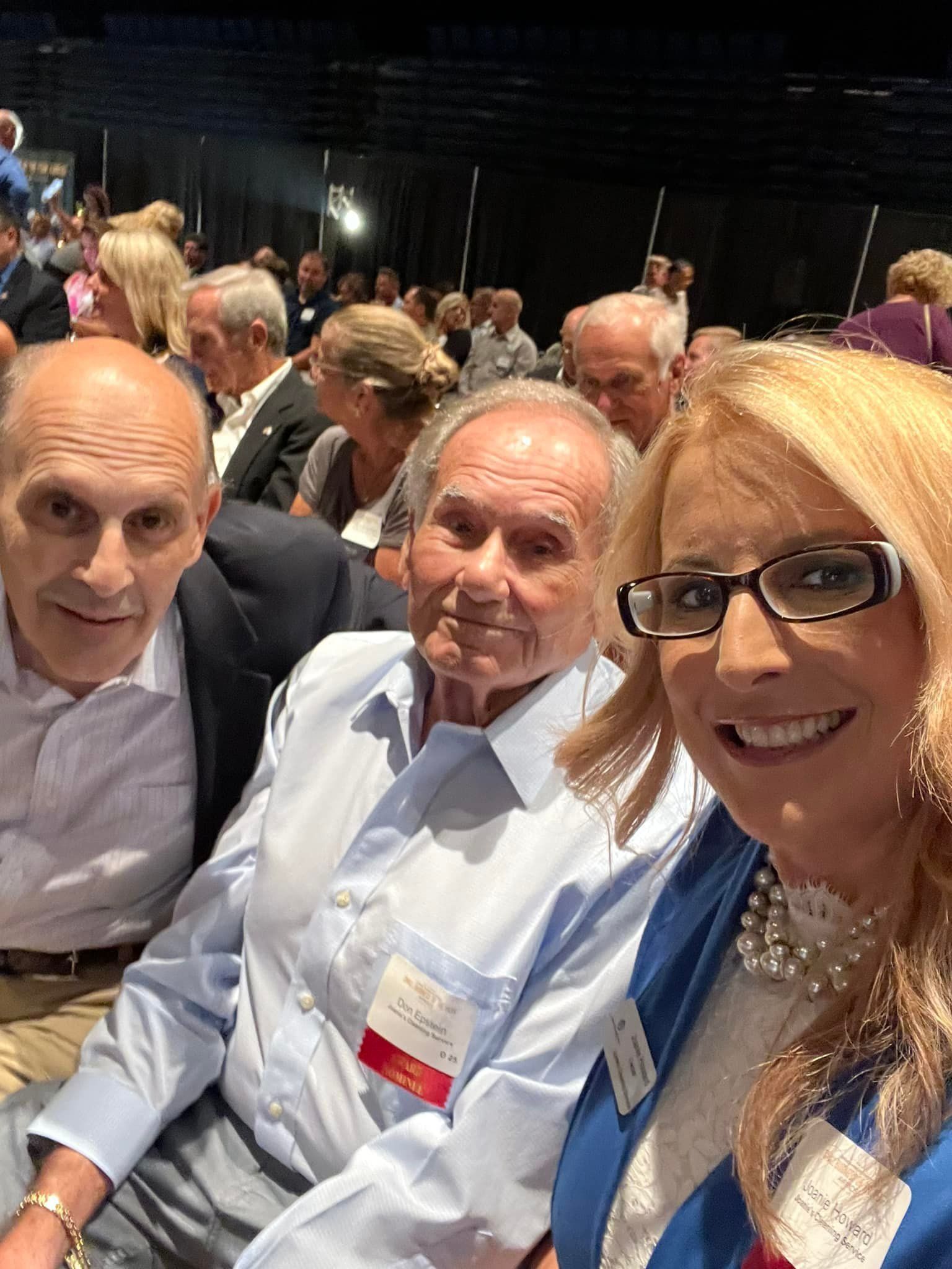Joanie, her father, and Don at the awarding ceremony