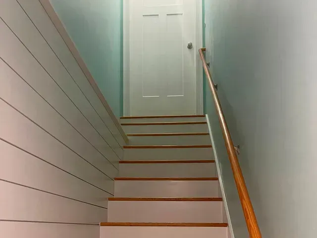 Learn More About Our Fixer stairs leading to a door