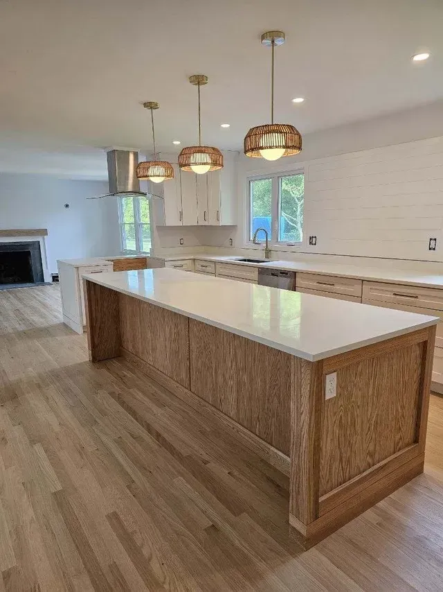 There is a large island in the middle of the kitchen.