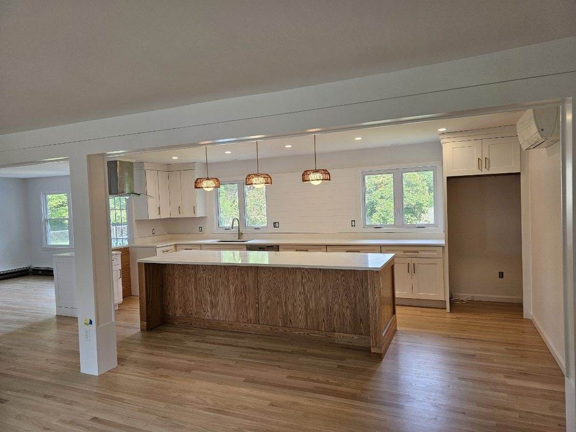 There is a large island in the middle of the kitchen.