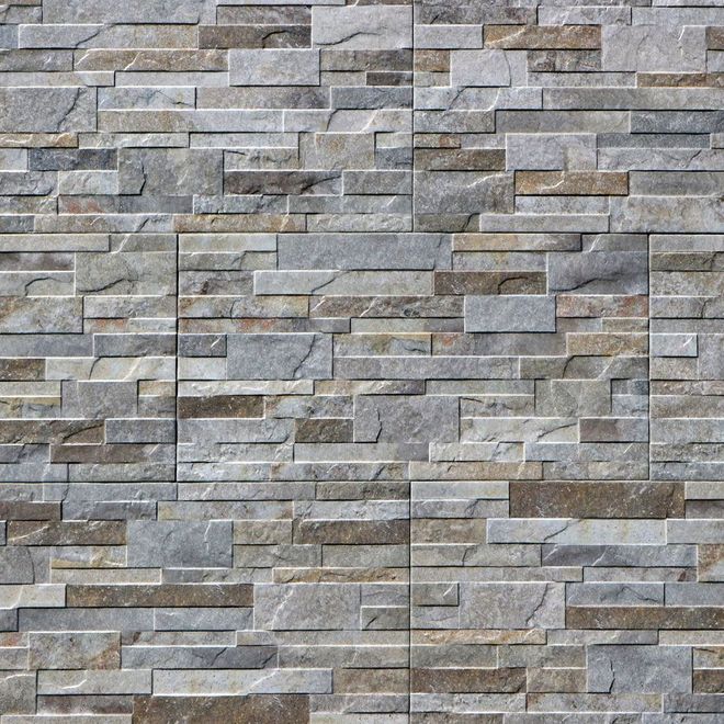 Stone tile wall in shades of gray, brown, and beige, with a textured, layered appearance.