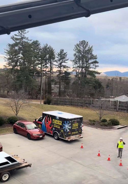 Floyds 4 Seasons Heating and Air Inc service truck in a commercial parking lot