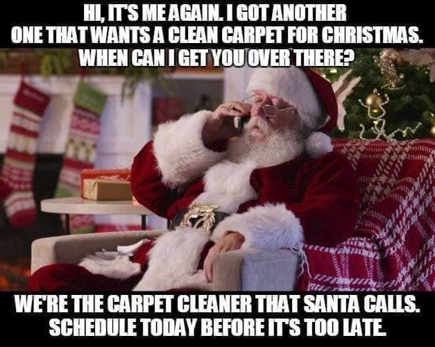 Santa claus is sitting on a couch talking on a cell phone