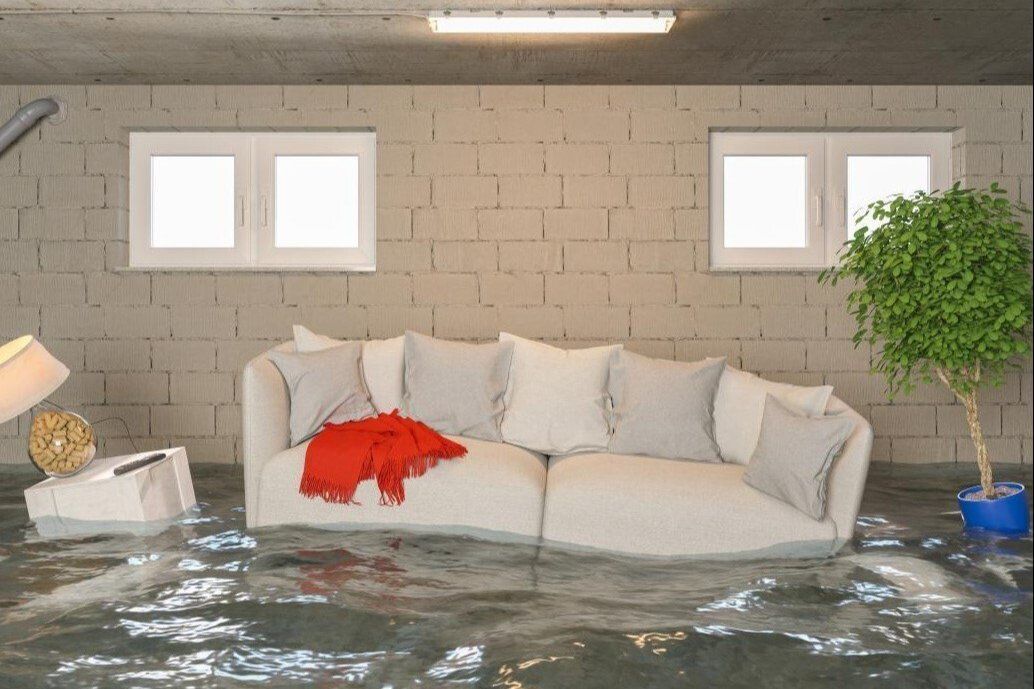 A living room filled with water and a couch
