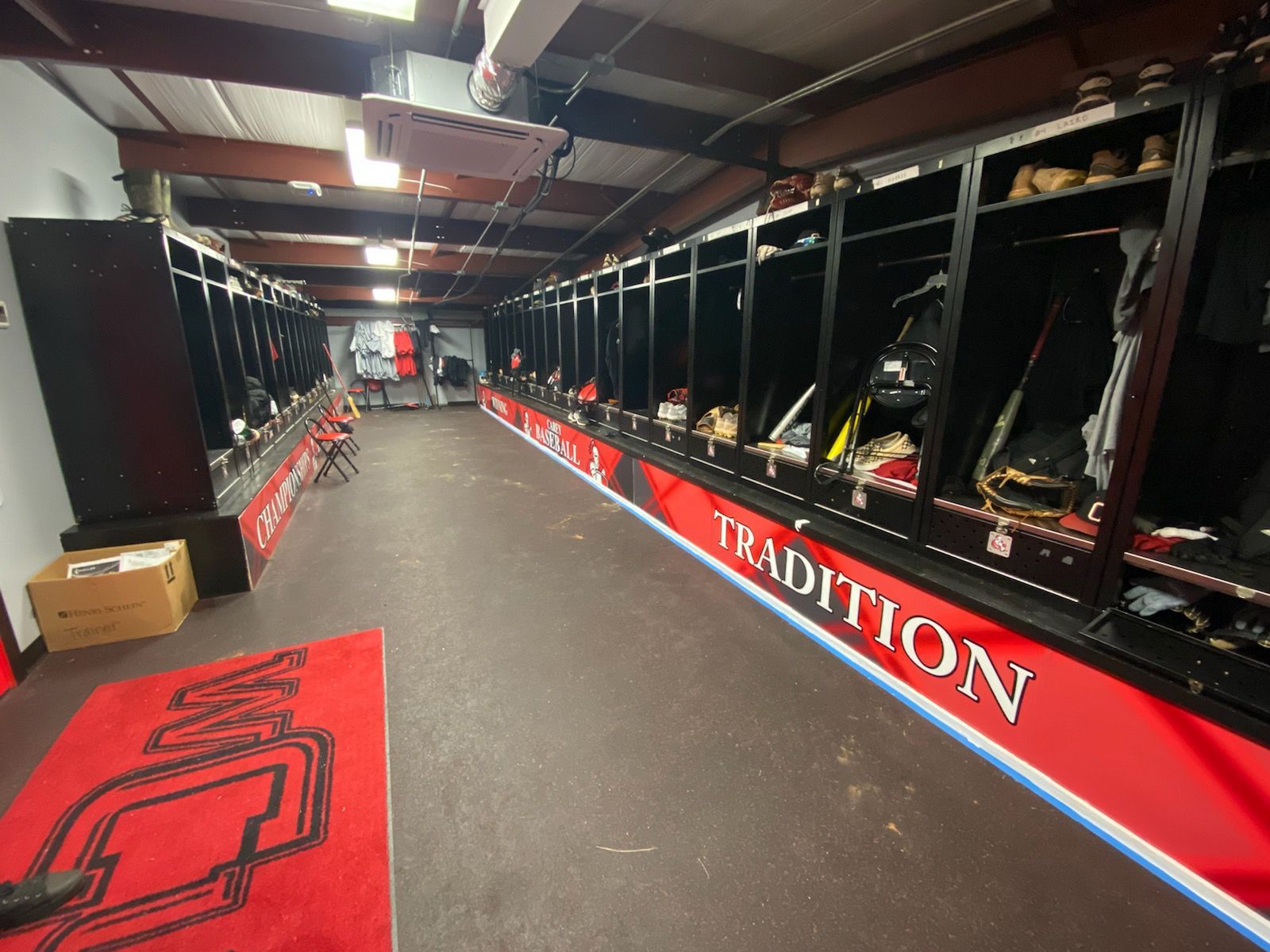 A locker room with the word tradition on the wall