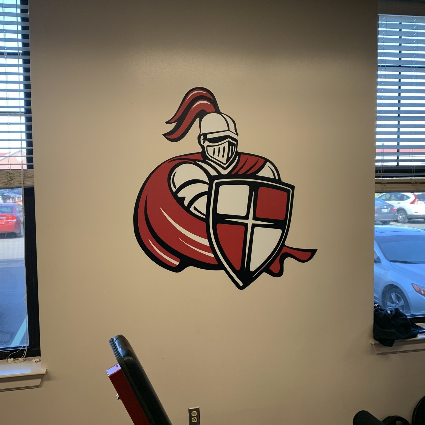 A knight with a shield is painted on a wall