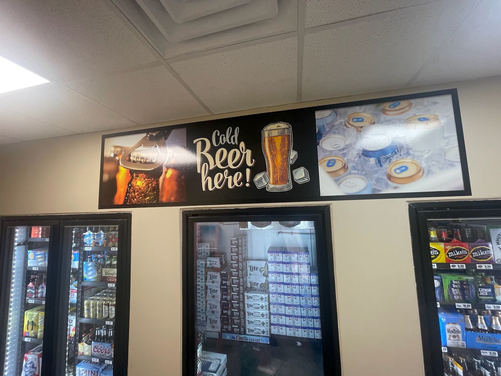 A store with a sign that says cold beer here