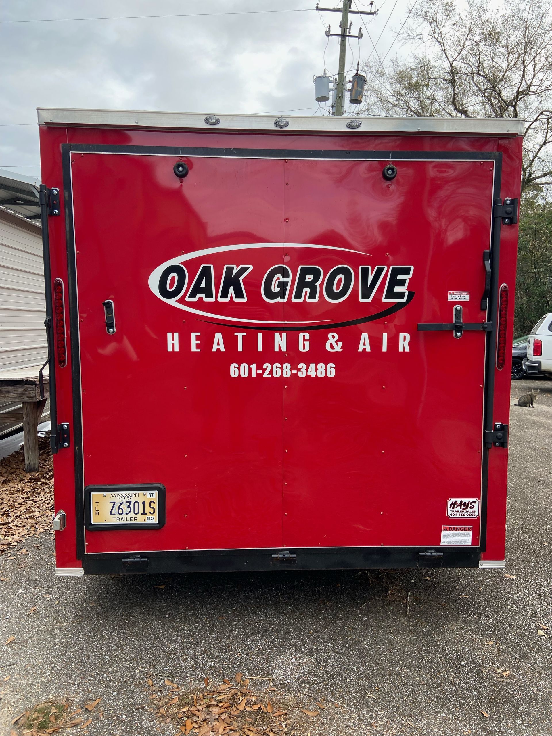 A red trailer for oak grove heating and air