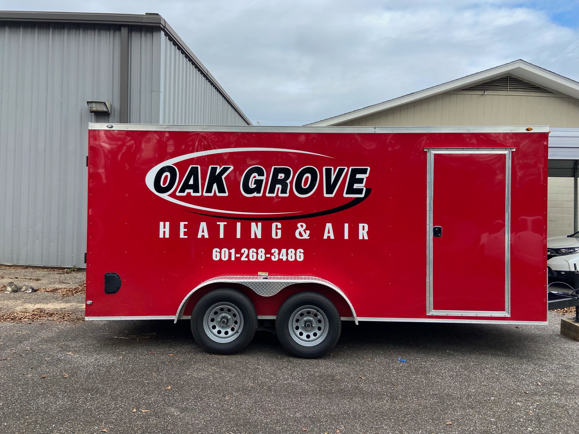 A red trailer for oak grove heating and air
