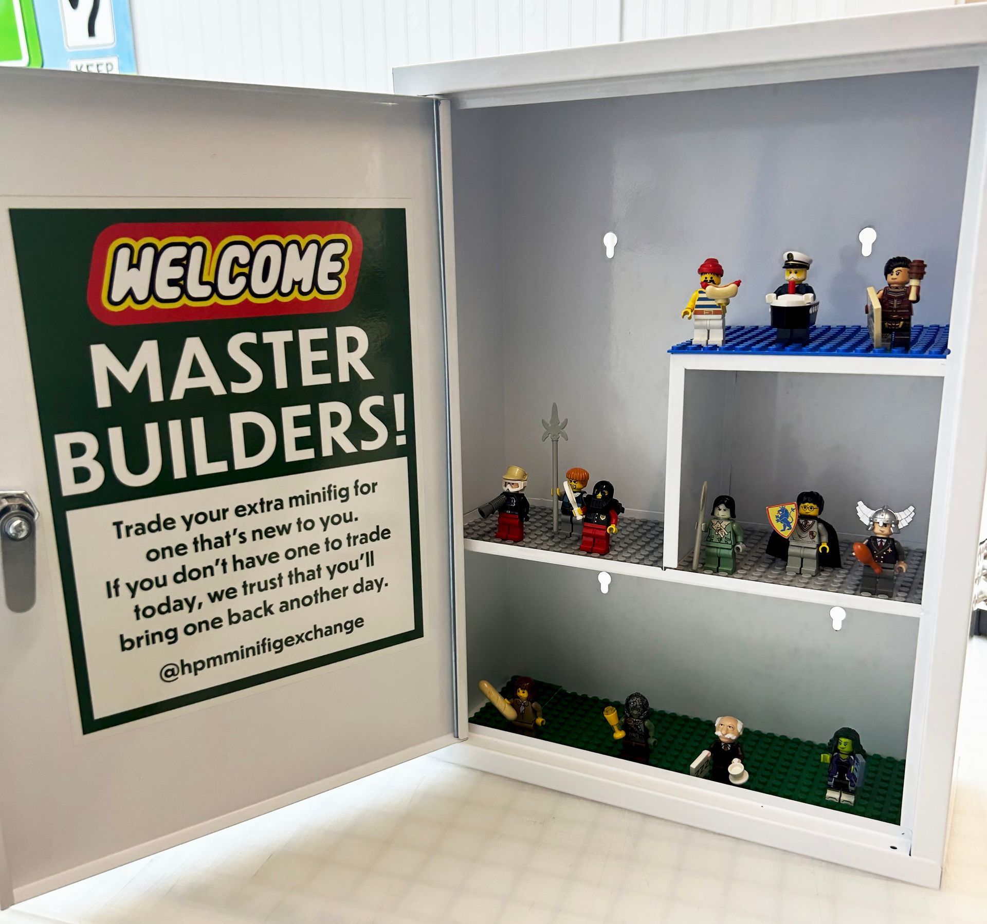A box with a sign that says welcome master builders