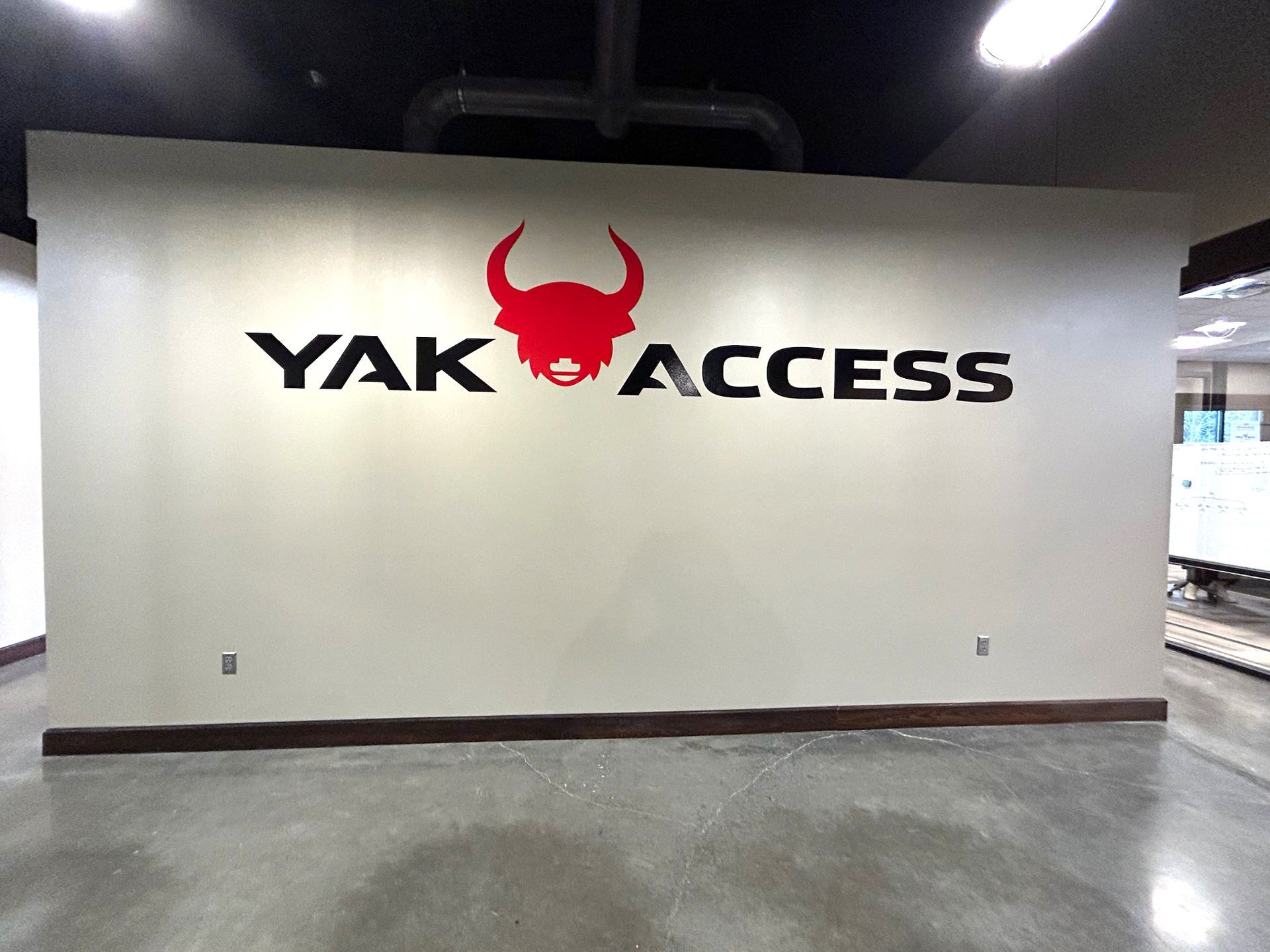 A wall with a yak access logo on it