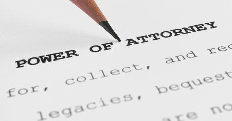 Pencil pointing on power of attorney paper