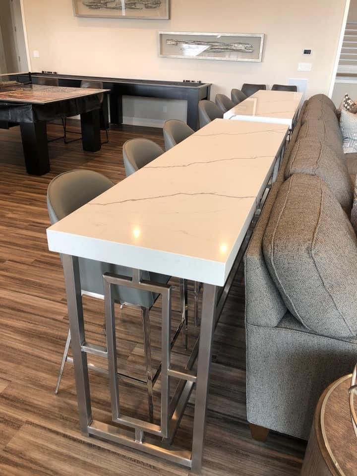 There is a long table in the middle of the room.