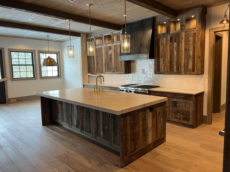 There is a large island in the middle of the kitchen.