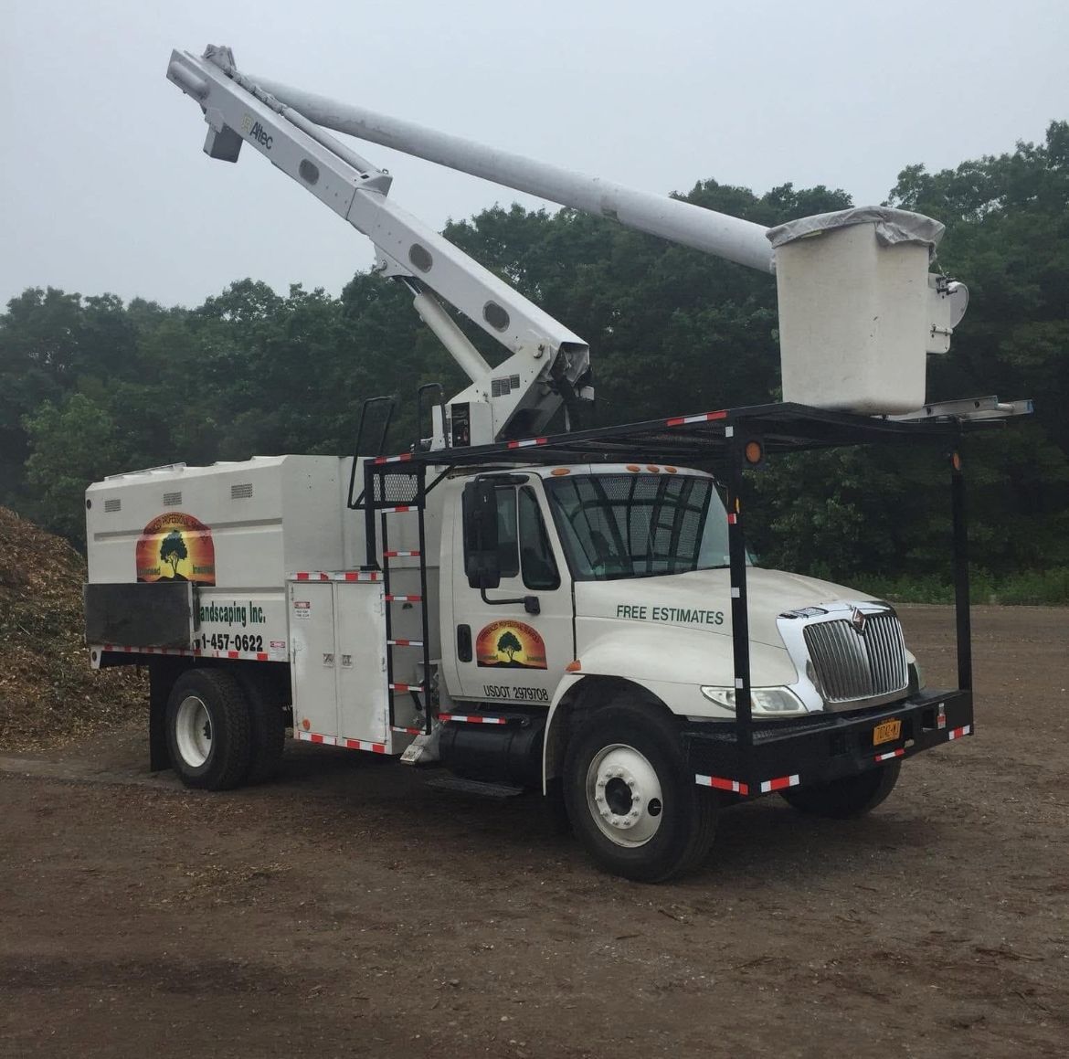 A white truck with a bucket on top of it and the word panic on the side