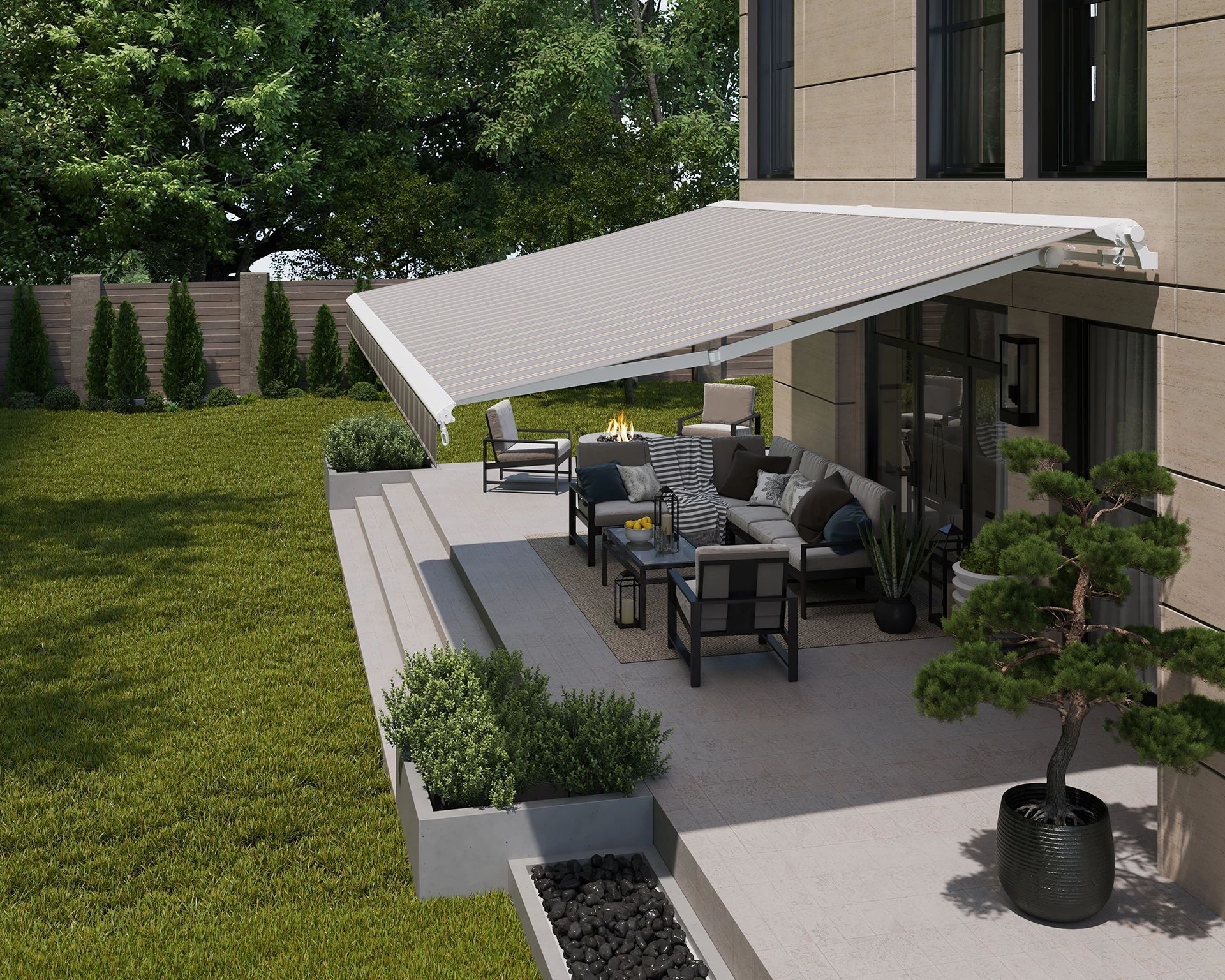 Beige awning over a patio with outdoor furniture, beside a house and a grassy yard.