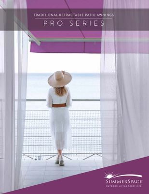 Woman in white dress and hat on a balcony overlooking the sea, marketing a patio awning.