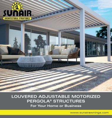Sunair louvered pergola with shadows on patio, modern outdoor seating.