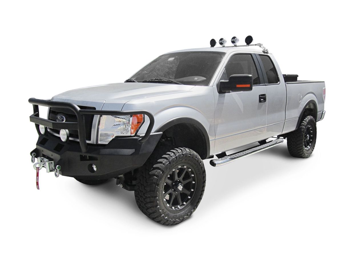Silver lifted pickup truck with off-road tires and black front bumper on a white background