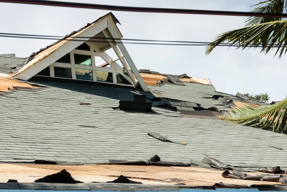 A roof that has been damaged by a storm