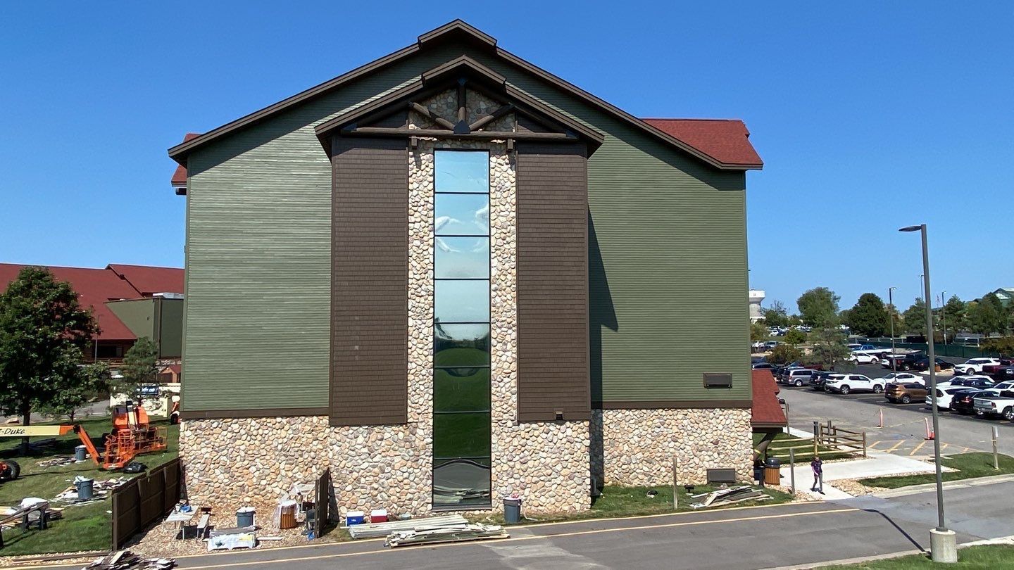 A large building with a lot of windows is being built.