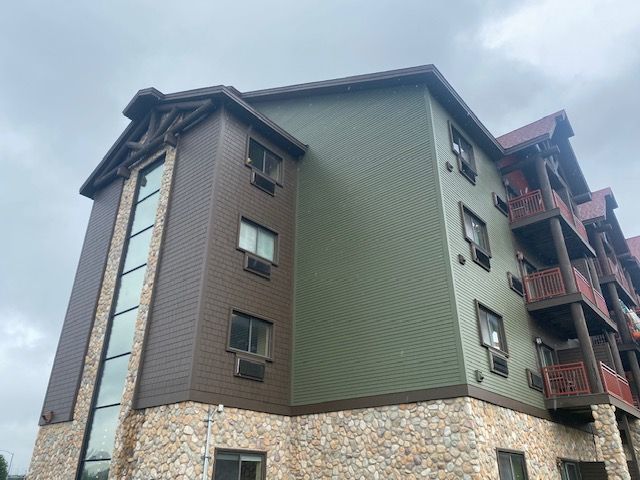 A large building with a lot of windows and balconies