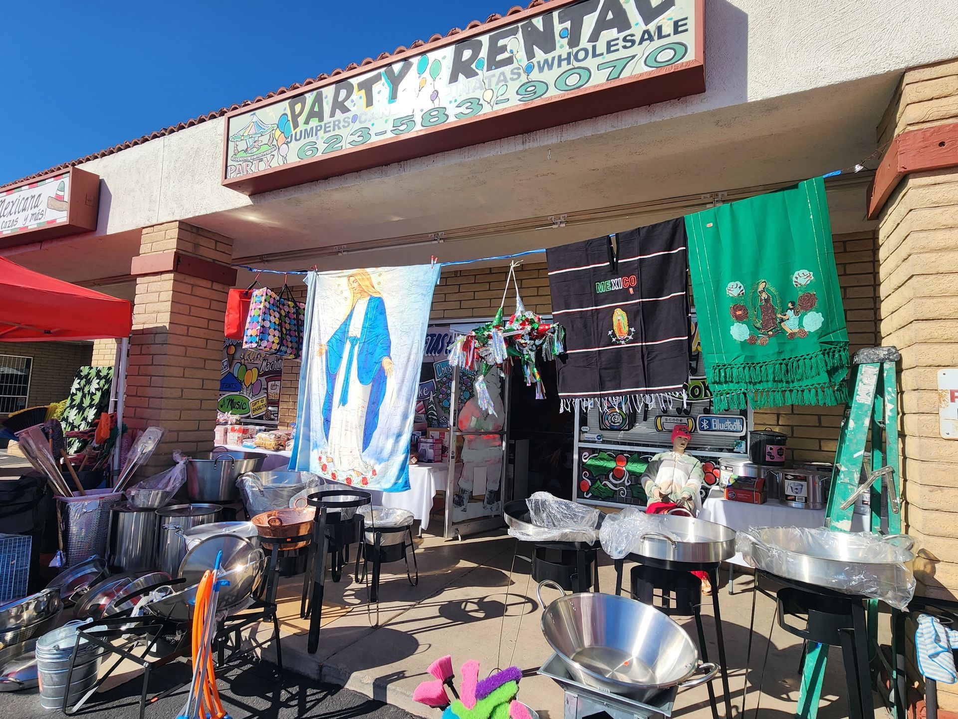 a store front with a sign that says party rental .