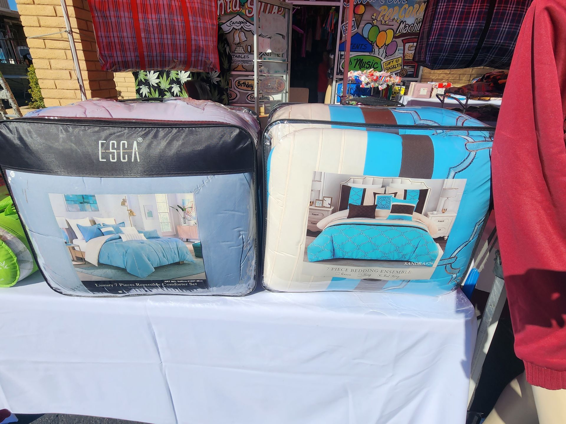 a bunch of blankets are sitting on top of a table .