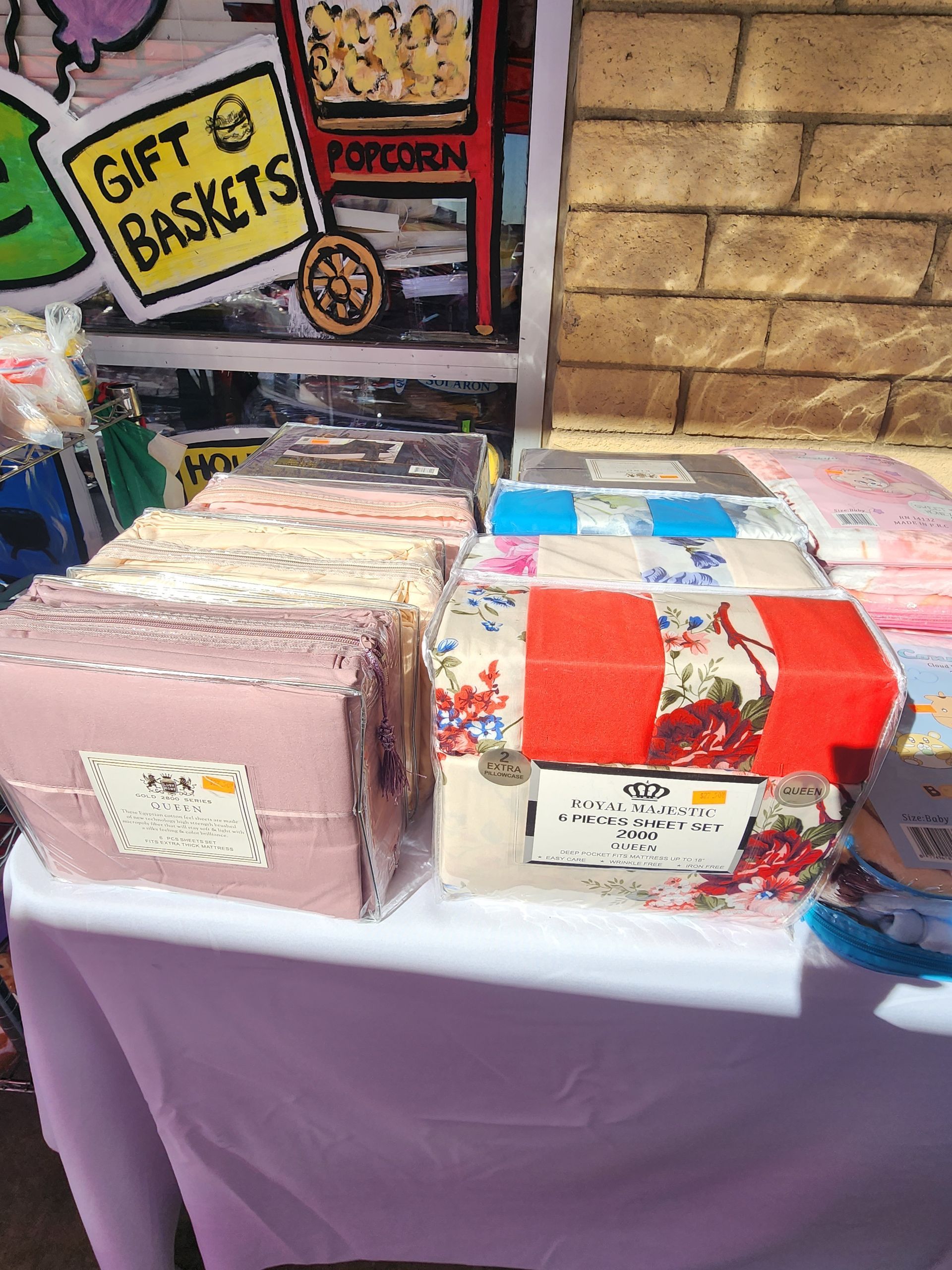 a table with sheet bedding sets