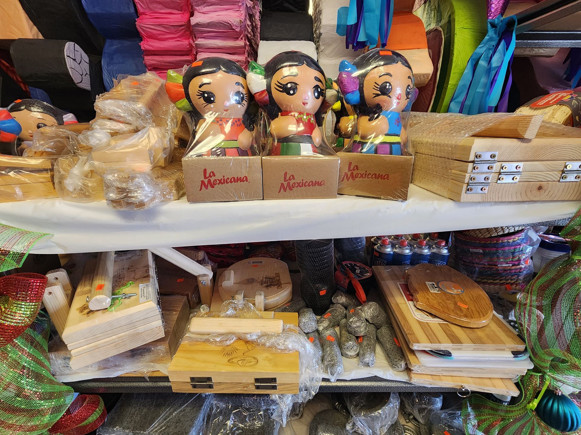 a shelf filled with lots of toys and boxes .