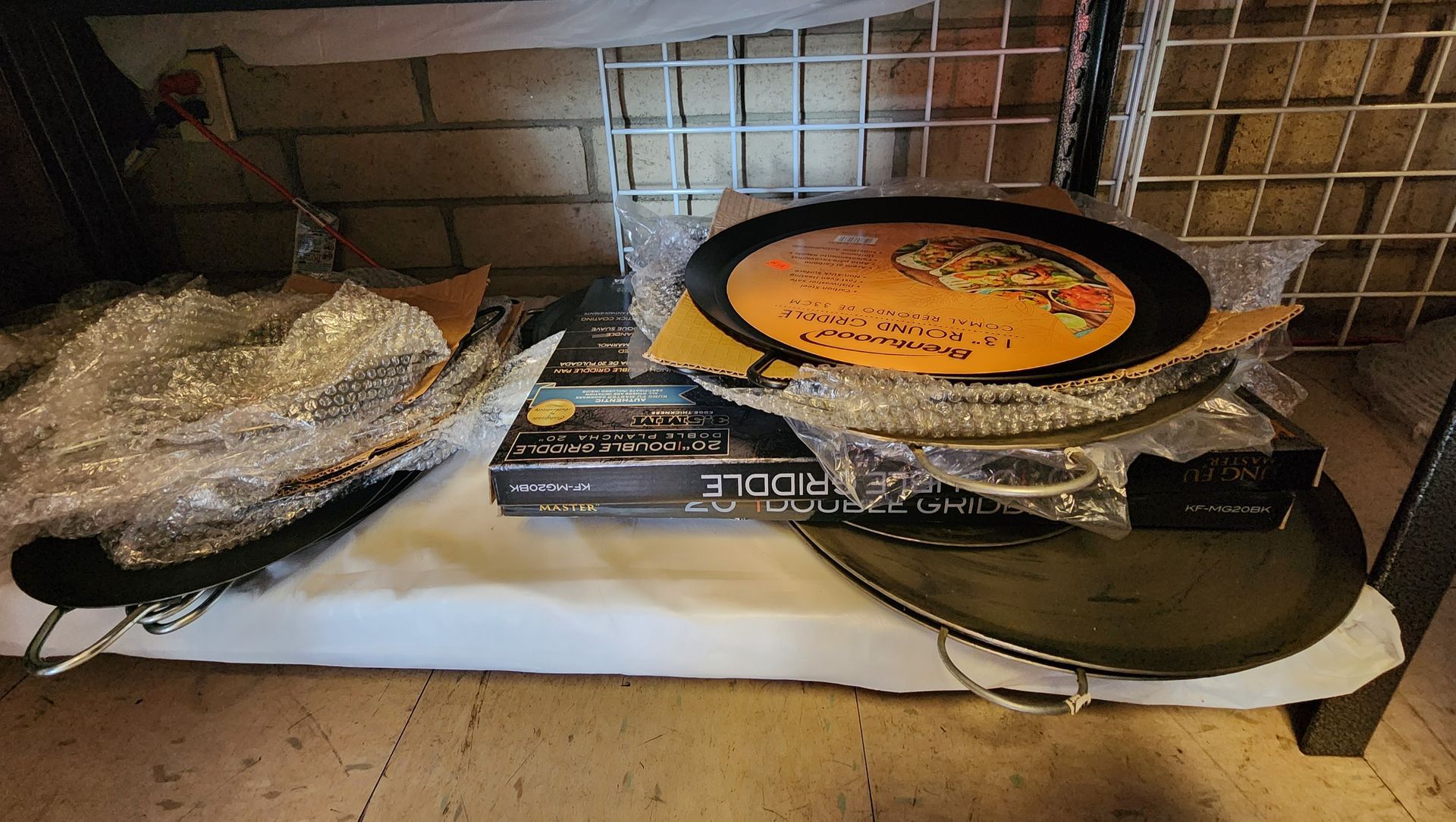a shelf with plates and cooking sheets