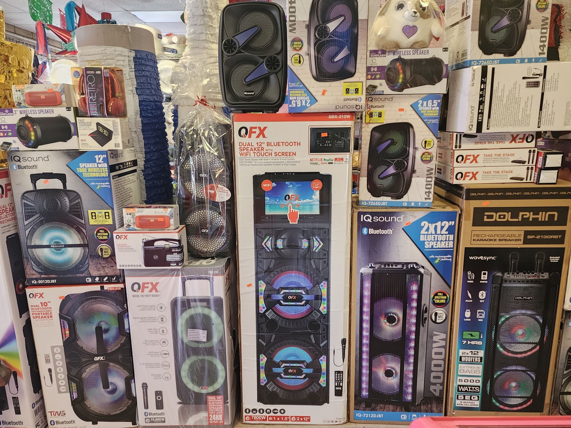 a bunch of speakers are stacked on top of each other in a store .