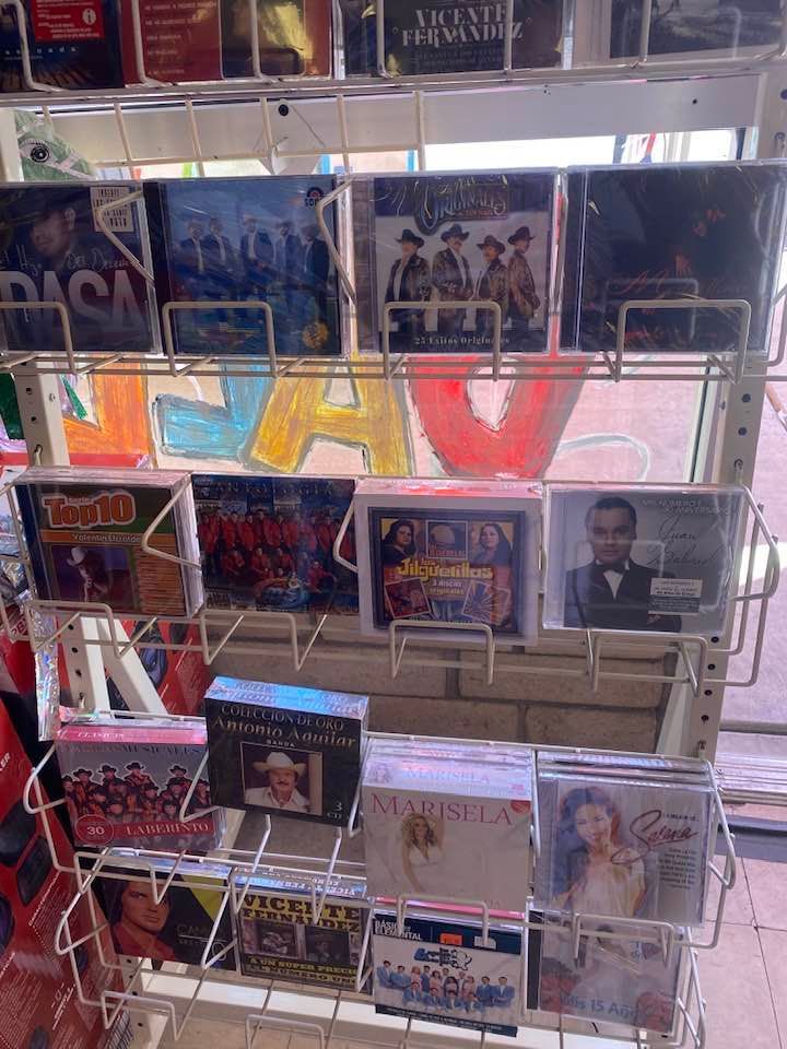 a bunch of cds are on display in a store