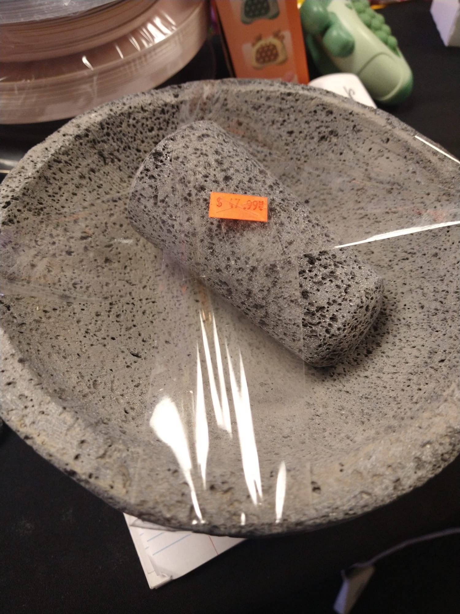 a stone mortar and pestle with a price tag on it