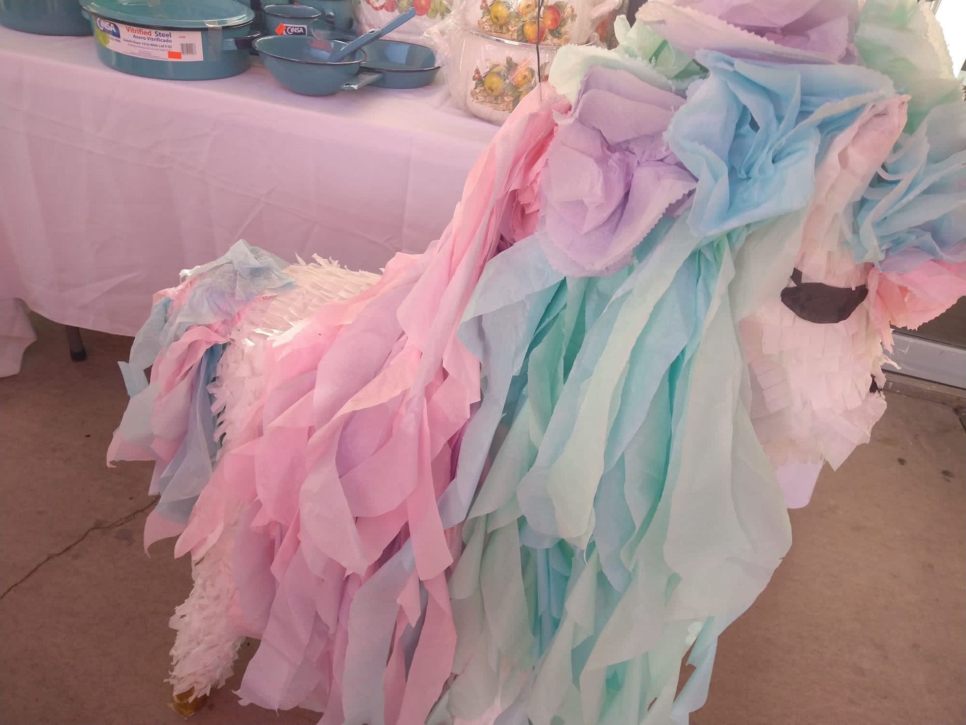 a unicorn made out of pink and blue tissue paper