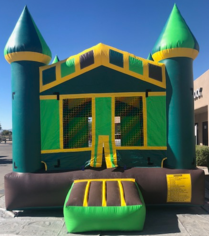 a green and yellow bouncy house is sitting on a sidewalk