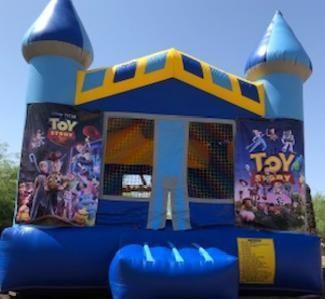 a blue and yellow bouncy house with toy story posters on it