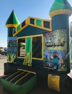 a green and yellow bouncy house with a minecraft poster on it 