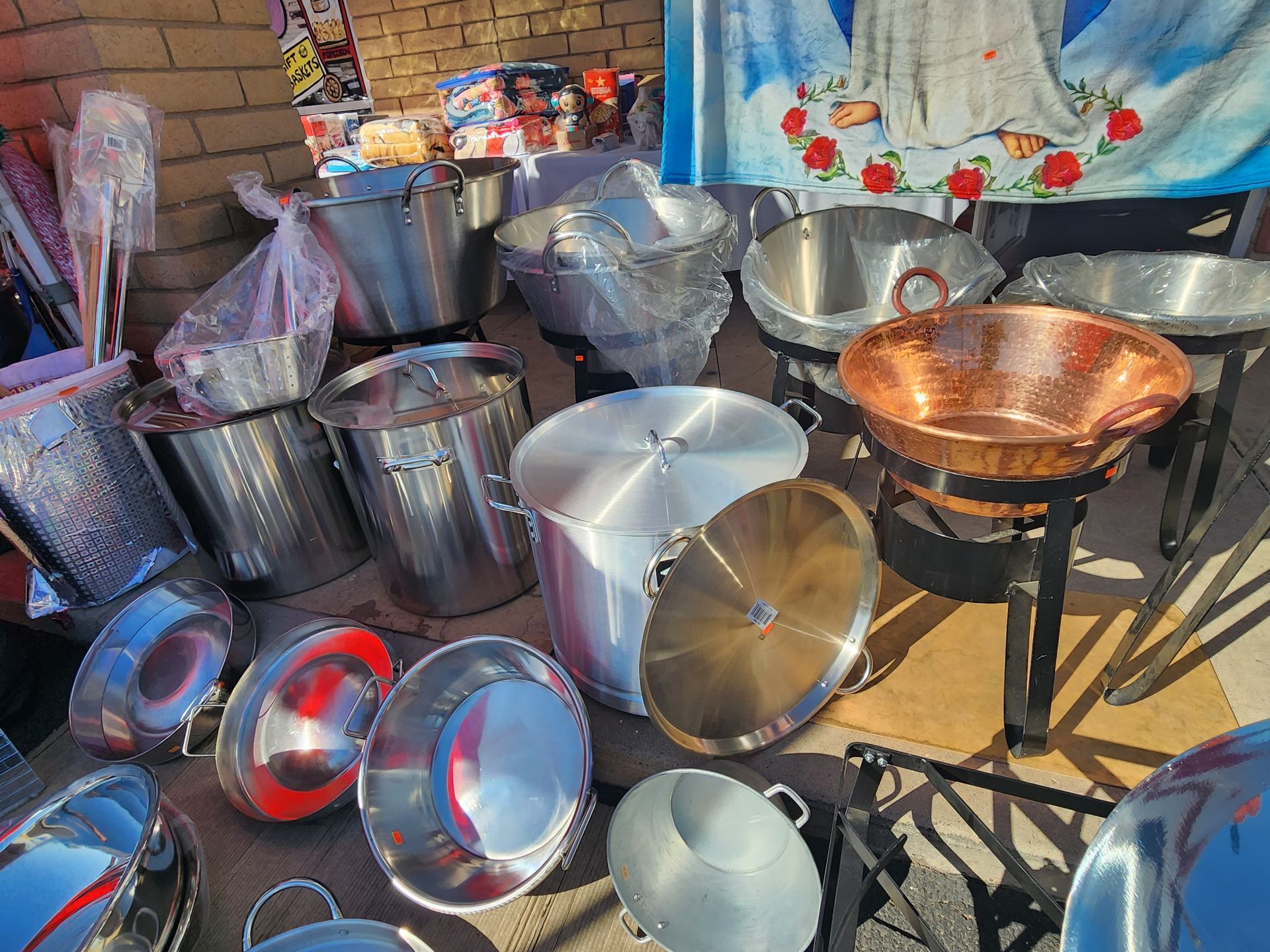 a bunch of pots and pans are sitting on a table .