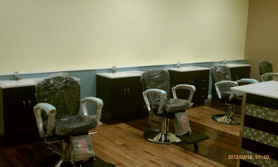 A room with a lot of chairs and a counter