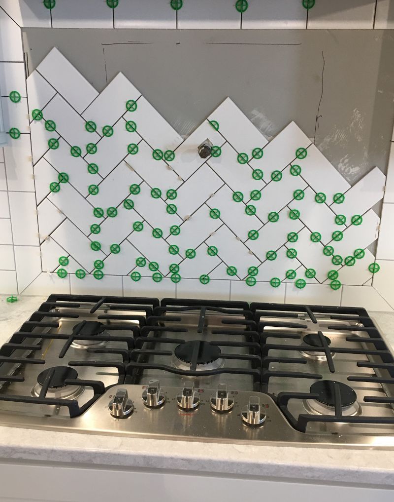 A stove top with a herringbone pattern on it