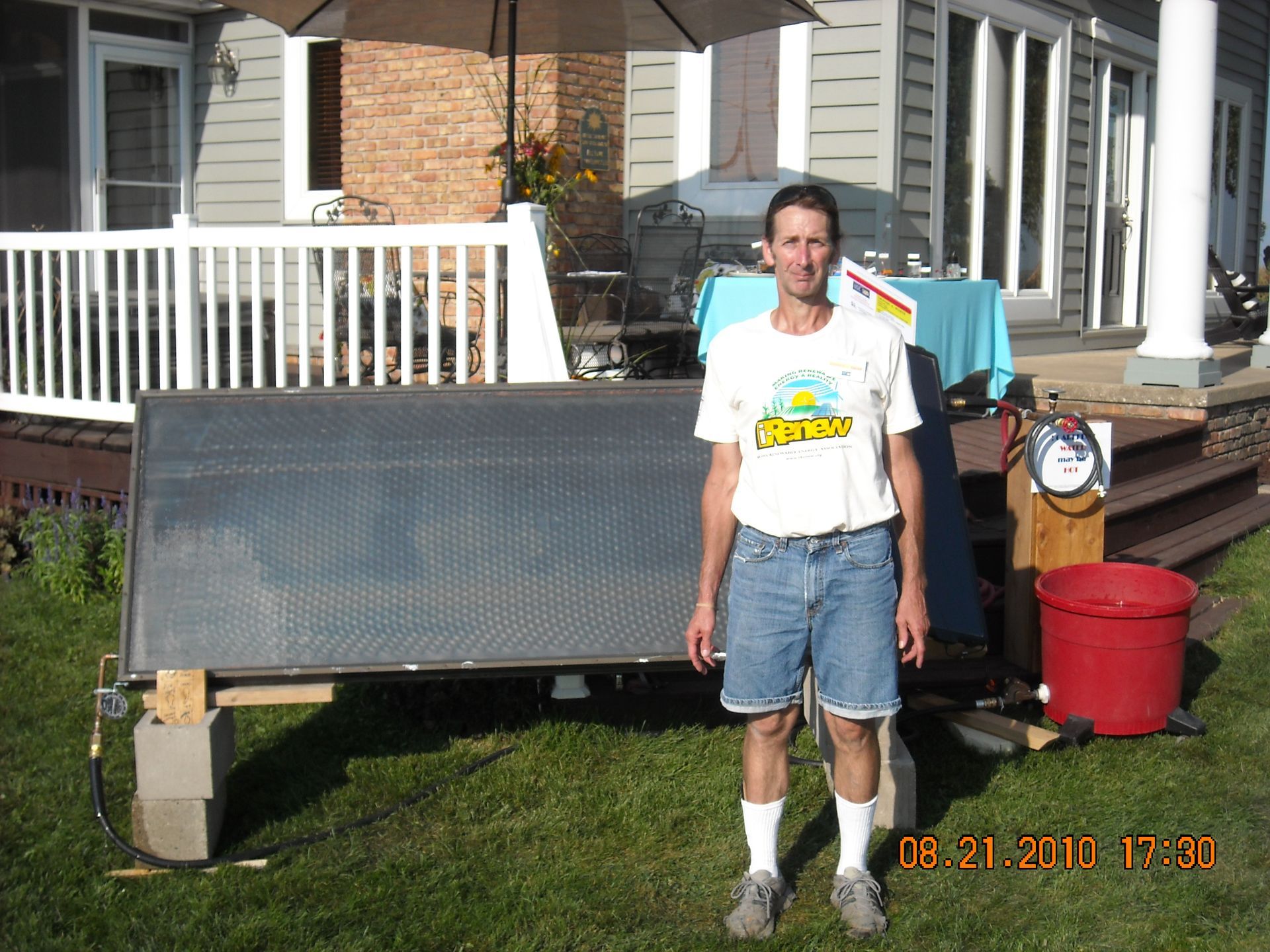 Dennis White Outside of a House